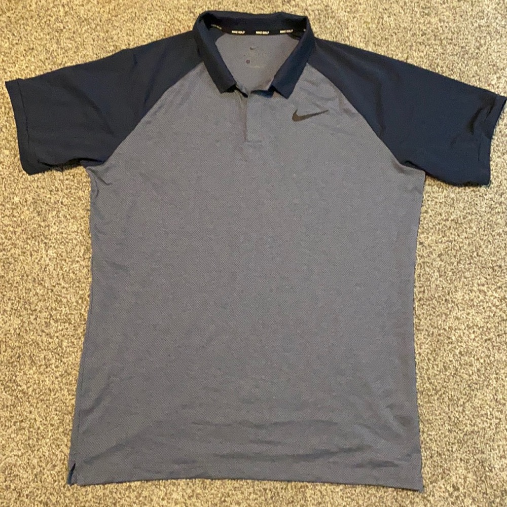 Blue Nike Dri-Fit medium golf shirt.